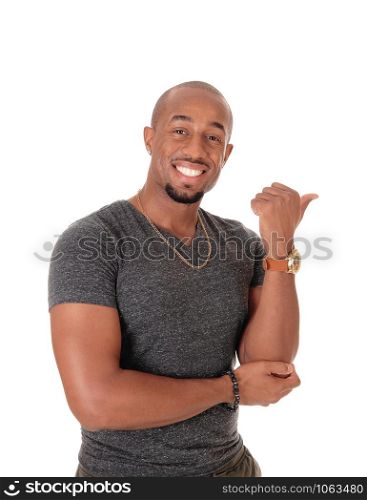 A smiling African American man standing in a sweater pointing with his thump to the other person, isolated for white background