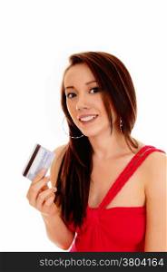 A smiling Asian woman in a red dress holding her credit card, ready forshopping, isolated for white background.