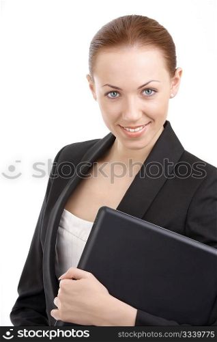 A smiling business woman carrying a notebook