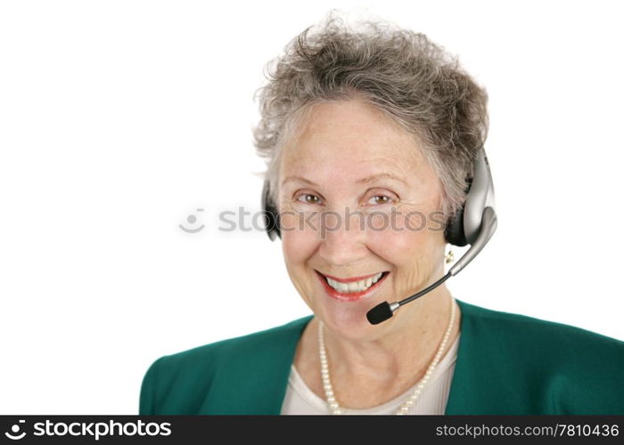 A smiling, cheerful senior lady with a telephone headset. Isolated on white.