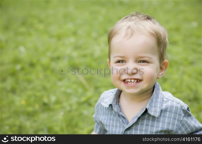 A Smiling Little Kid Outdoors