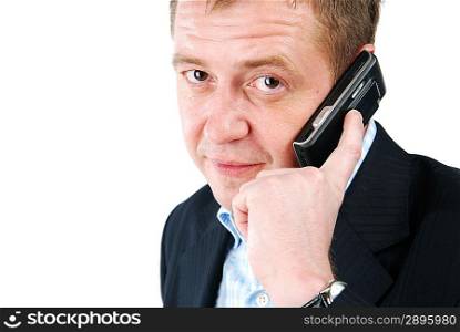 a smiling man talking over phone and looks at you