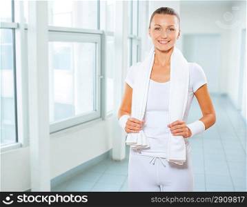 a smiling sportswoman with towel
