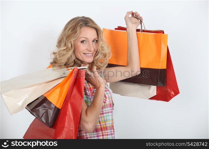 A smiling woman who enjoyed a shopping spree.