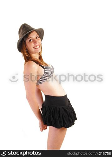 A smiling young woman in a black mini skirt, bra and gray hat, bendingbackwards for white background, having fun with the shoot.