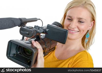 a smiling young woman in yellow t-shirt with professional camcorder, on white