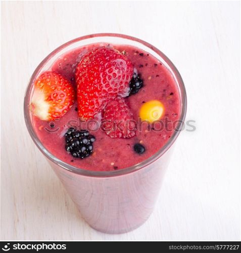 A smoothy made from different types of fresh berries.