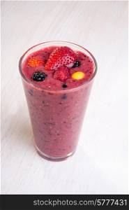 A smoothy made from different types of fresh berries.