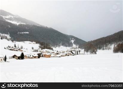 A snow-covered mountain village, in Western Switzerland