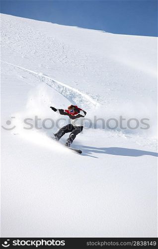 A snowboarder floating down a mountain