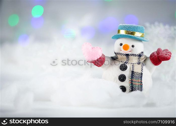 A snowman and mini heart pillow on bokeh background, with copy space for season greeting. Merry Christmas or Happy New Year, AF point selection, Classicchrome tone.