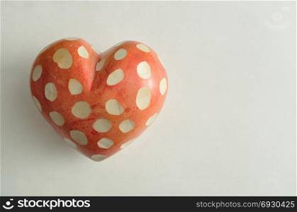 A spotted heart isolated on a white background
