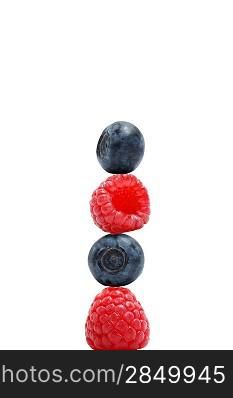 A stack of blueberries and raspberries