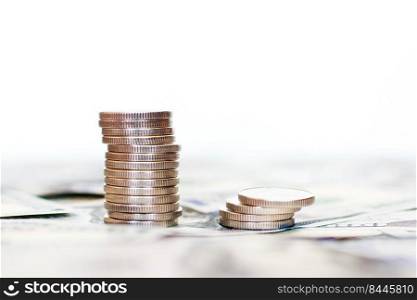 A stack of coins on an isolated white background. dollars background.. A stack of coins on an isolated white background. dollars background