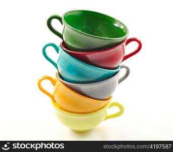 a stack of colorful coffee or tea cups