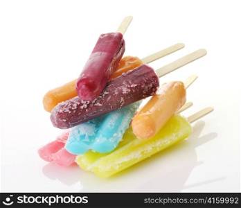 a stack of colorful ice cream pops
