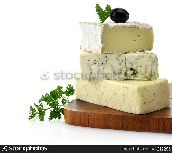 A Stack Of Different Kinds Of Cheese On A Cutting Board