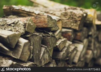 A stack of firewood close up . A stack of firewood close up with a large depth of field
