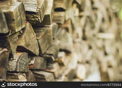 A stack of firewood close up . A stack of firewood close up with a large depth of field