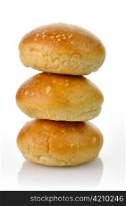 a stack of fresh breakfast rolsl on a white background