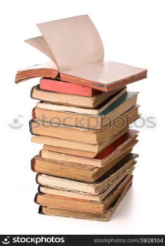 a stack of old books on white background