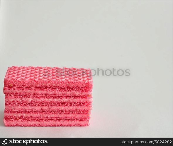 A stack of pink wafer biscuits