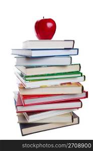 A stack of text books with a bright, red apple on top. Shot on white background.