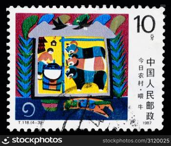 A stamp printed in China shows the modern village, circa 1987