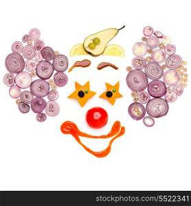 A star-eyed clown made of vegetables.