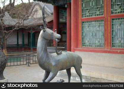A Statue Of A Qilin Standing Before The Summer Palace In Beijing