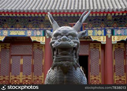 A Statue Of A Qilin Standing Before The Summer Palace In Beijing