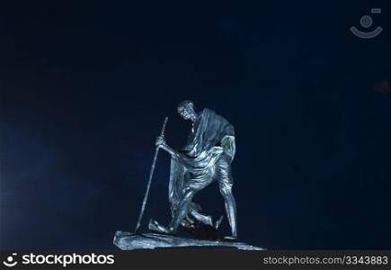 A statue of Mahatma Gandhi beautifully lit by the lights