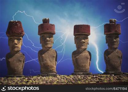 A statue on Easter Island or Rapa Nui in the southeastern Pacific, the territory of Chile. A strong thunderstorm and a lot of lightning.. statue on Easter Island or Rapa Nui in the southeastern Pacific