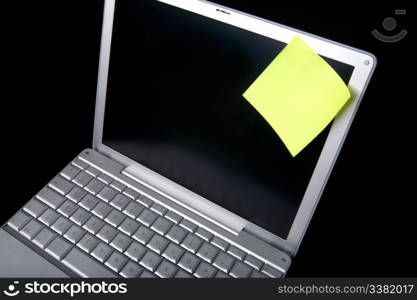 A sticky note on a laptop computer - remember this