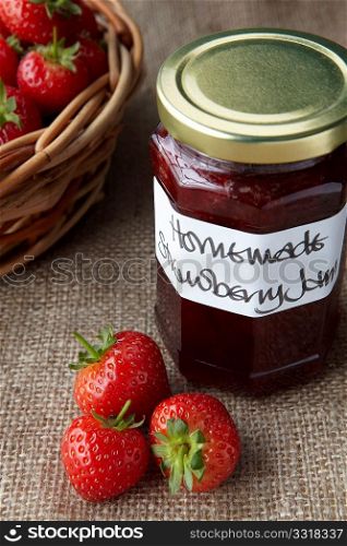 A still life of strawberry jam