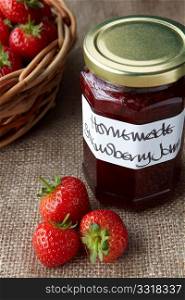 A still life of strawberry jam