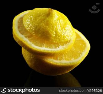 a stock of lemon slices on black background