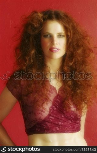 A stock photo of a beautiful red haired woman in the studio.