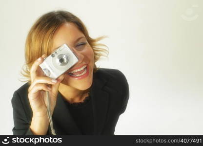 A stock photo of a business woman using a digital camera