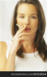 A stock photo of a woman smoking
