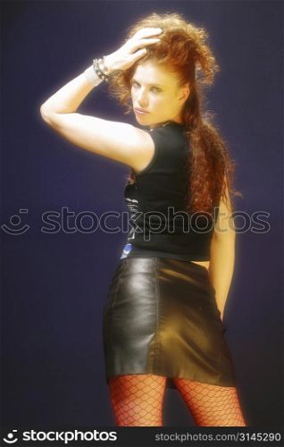 A stock photo of a woman wearing a tight leather skirt