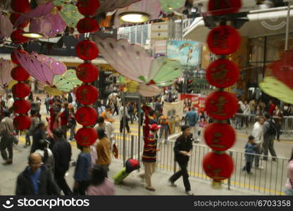 A stock photo of buildings and people in Hong Kong, a typical lifestyle in a big crowded city in Asia. Hong Kong.