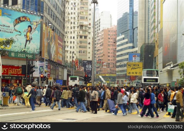 A stock photo of buildings and people in Hong Kong, a typical lifestyle in a big crowded city in Asia. Hong Kong.