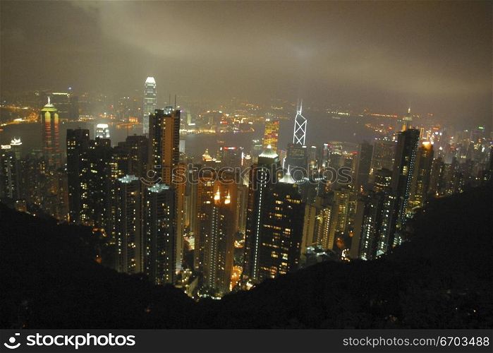 A stock photo of buildings and people in Hong Kong, a typical lifestyle in a big crowded city in Asia. Hing Kong Asia.