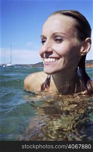 A stock photograph of a beautiful young woman&acute;s portrait in the water.