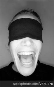 A stock photograph of a blindfolded woman.