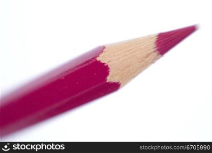 A stock photograph of a color pencil photographed in a close up, focussing on the sharpened tip.