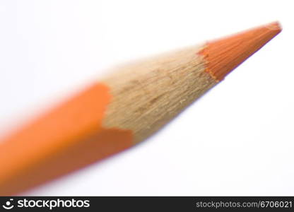 A stock photograph of a color pencil photographed in a close up, focussing on the sharpened tip.