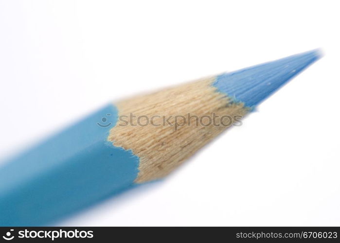 A stock photograph of a color pencil photographed in a close up, focussing on the sharpened tip.