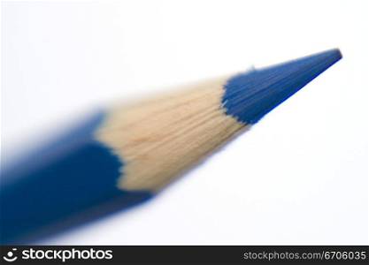 A stock photograph of a color pencil photographed in a close up, focussing on the sharpened tip.